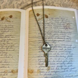 Engraved Brass Key necklace “ strength“